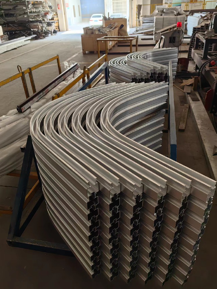 Stretch Forming Applied to Textile Machinery Tracks