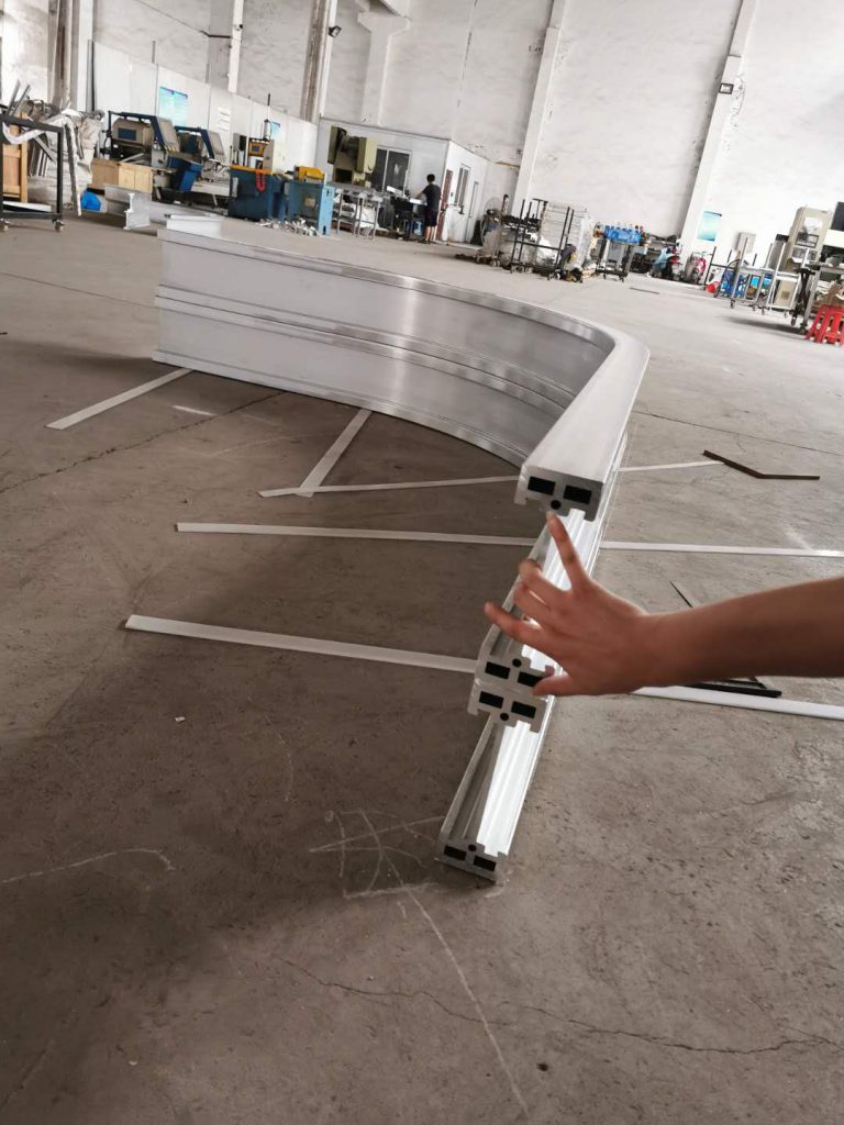 Stretch Forming Applied to to Logistics Tracks